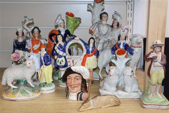 A large group of Staffordshire pottery figures